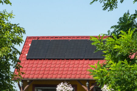 Solar power energy on the roof to a standard house. Solar power panels ,Photovoltaic modules for innovation green energy for life with blue sky background. High quality photoの写真素材