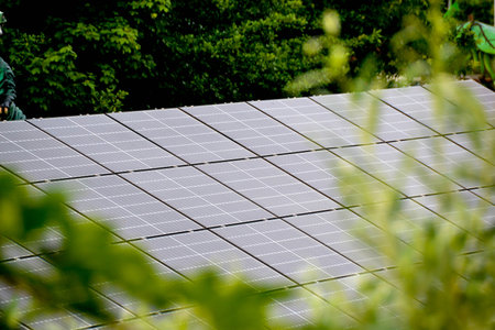 House roof with photovoltaic modules. Historic farm house with modern solar panels on roof and wall High quality photoの写真素材