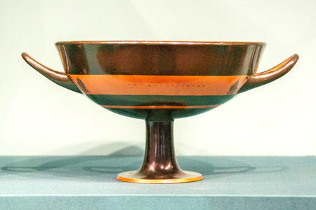 Antique ceramic decorative amphora on a white background. Clay jugs and a pot, a set of ancient utensils for drinking wine, water or milk. High quality photoの写真素材