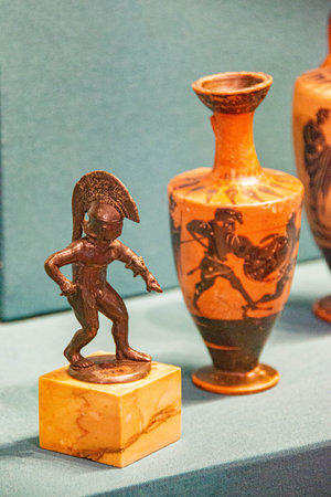 Antique ceramic decorative amphora on a white background. Clay jugs and a pot, a set of ancient utensils for drinking wine, water or milk. High quality photoの写真素材