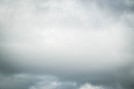 White passenger airplane flying in the sky amazing clouds in the background - Travel by air transport. High quality photoの写真素材