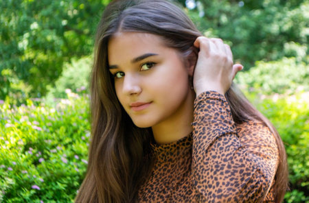 close up portrait of young and tender woman on a feild at sunset. High quality photoの写真素材