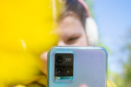 Young photographer taking a picture with is camera. High quality photo