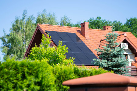 Solar power energy on the roof to a standard house. Solar power panels ,Photovoltaic modules for...