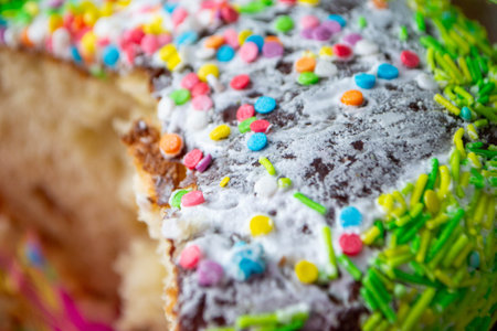 Traditional easter holiday table served with homemade easter cake . A cake with sprinkles on it is decorated with colorful sprinkles. High quality photoの写真素材