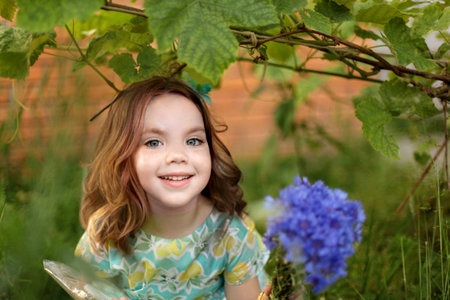 Cute kid girl 10 year old posing on nature background. Looking at camera. Childhood.Blonde girl...