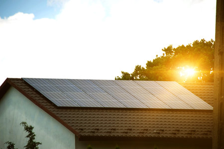 Solar power energy on the roof to a standard house. Solar power panels ,Photovoltaic modules for...