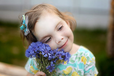 beautiful girl in the park, best focus on the face,background blurred. portrait of a beautiful little girl in summer. High quality photoの写真素材