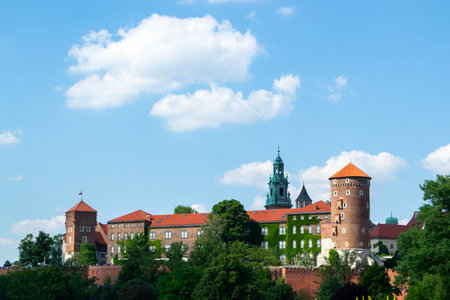 The view of the Wawel Royal Castle from the ground. Fortress wall, Wawel Danish tower, representative royal chambers. Ancient facade of the building Wawel Castle City of Krakow. High quality photoの写真素材
