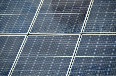 Photo collage of sunset and solar panel, photovoltaic, alternative electricity source - concept of sustainable resources. High quality photoの写真素材