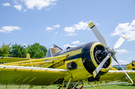Samples of old military equipment. The engine and propeller of the cargo plane against blue cloudy...