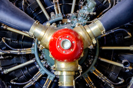 detail of old airplane engine with propeller. Close up of a red plane propeller. Damaged jet engine...