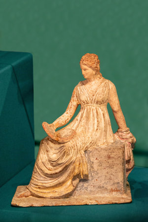 Large bosom on marble goddess sculpture. Museum photography. Ancient roman marble statue. Person figure statue isolated on colored background. Antique sculpture. High quality photoの写真素材