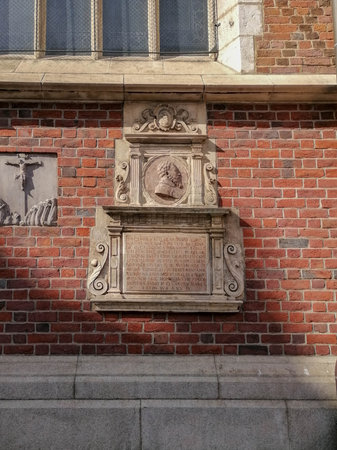 Beautiful Krakow market square. Faded colors. Vintage elegant carriages with beautifully dressed horses ride people around the historic center of Krakow on the old streets of Europe High quality photoの写真素材