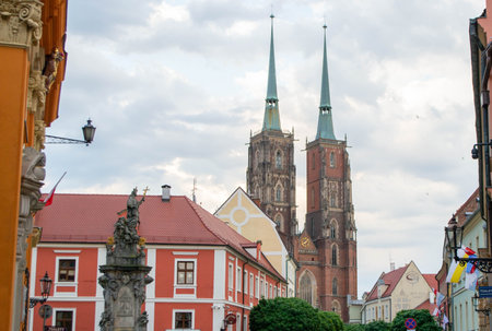 Beautiful Wroclaw market square. Faded colors. Vintage elegant carriages with beautifully dressed horses ride people around the historic center of Wroclaw on the old streets of Europe. High quality photoの写真素材