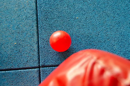 Boy playing on the playground, in the children's maze with balls. Multi-colored balls, soft walls and floor for children.の写真素材