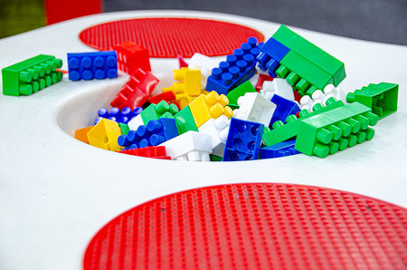 Colorful rainbow plastic toy bricks blocks isolated on white. Education concept. Blue, red and yellow toy bricks background . High quality photoの写真素材