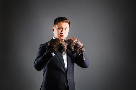 Portrait  attractive man wearing boxing-glovesの写真素材
