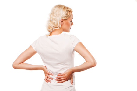 Woman with backache  Female holding her painful back  on white background