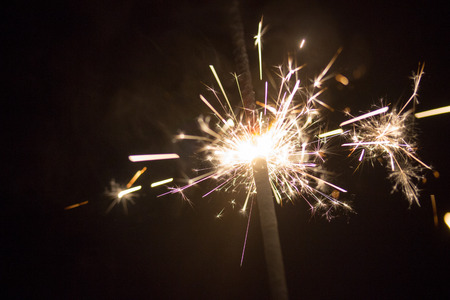 Christmas colorful sparklers holiday background for xmas new yearの写真素材