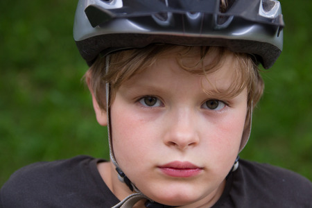 Boy with helmet on bikeの写真素材