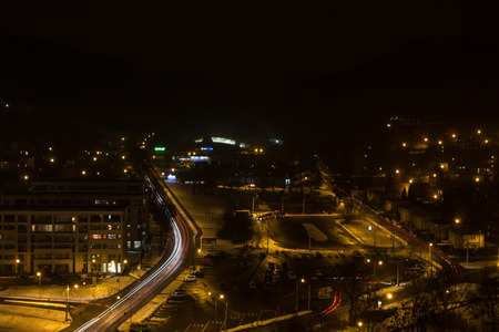 Evening picture of the city, hired transport and riding cars.