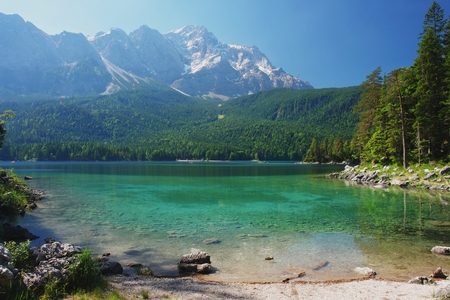 View of a mountain lake Eibsee and Zugspitze, Germanyの写真素材