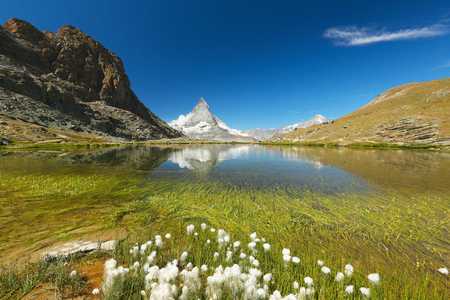 View of the lake Riffelsee and Matterhorn, Zermatt, Switzerlandの写真素材