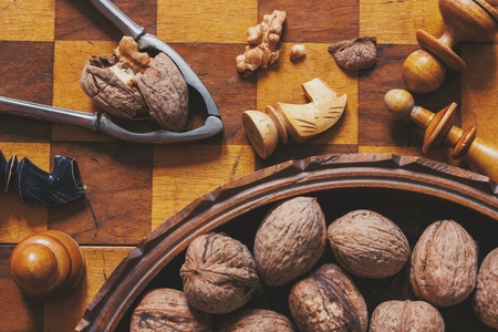 Autumn mood. Chess and walnuts. Food and games concept.の写真素材