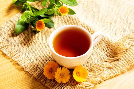 honey with dandelions. cup of tea with dandelion. selective focus.natureの写真素材