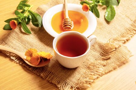 honey with dandelions. cup of tea with dandelion. selective focus.natureの写真素材