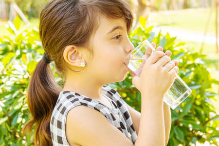 child glass of water. selective focus. Childrenの写真素材