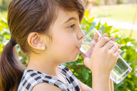 child glass of water. selective focus. Childrenの写真素材