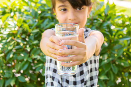child glass of water. selective focus. Childrenの写真素材
