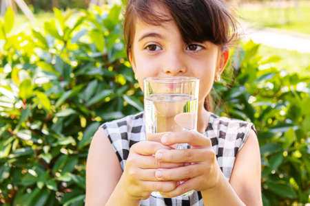child glass of water. selective focus. Childrenの写真素材
