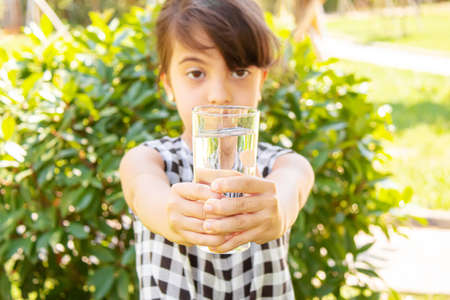 child glass of water. selective focus. Childrenの写真素材