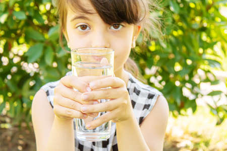 child glass of water. selective focus. Childrenの写真素材