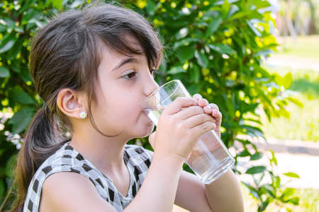 child glass of water. selective focus. Childrenの写真素材