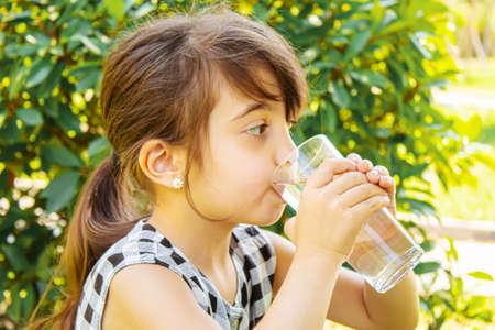 child glass of water. selective focus. Childrenの写真素材