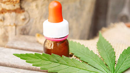 Cannabis essential oil in a small bottle. Selective focus. nature.の写真素材
