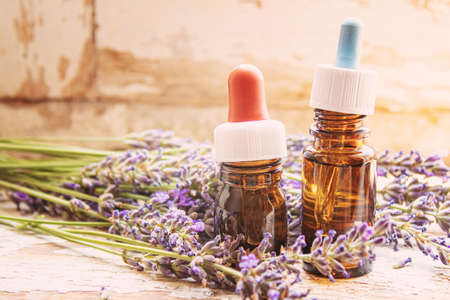 Lavender essential oil in a small bottle. Selective focus. nature.の写真素材