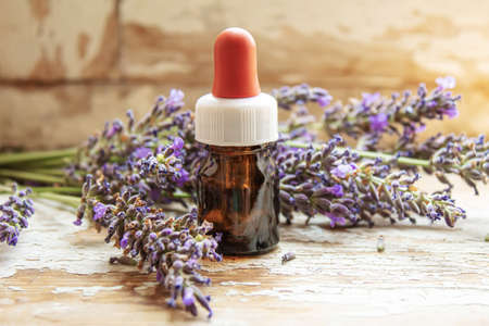 Lavender essential oil in a small bottle. Selective focus. nature.の写真素材