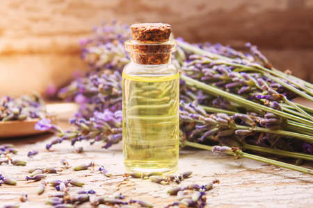 Lavender essential oil in a small bottle. Selective focus. nature.の写真素材