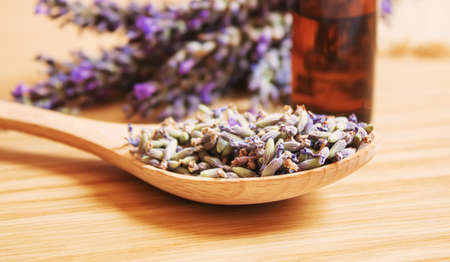 Lavender essential oil in a small bottle. Selective focus.の写真素材