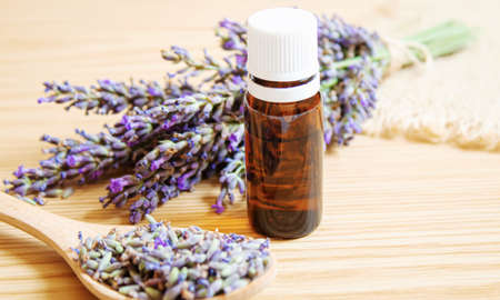 Lavender essential oil in a small bottle. Selective focus.の写真素材
