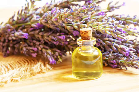 Lavender essential oil in a small bottle. Selective focus.の写真素材