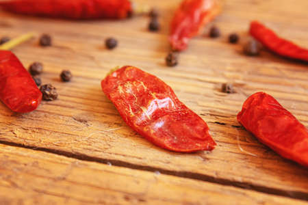 hot chili peppers on wooden background.