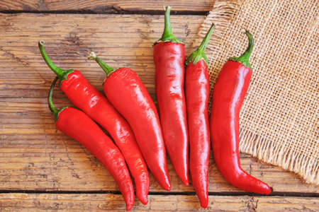hot chili peppers on wooden background. selective focusの写真素材