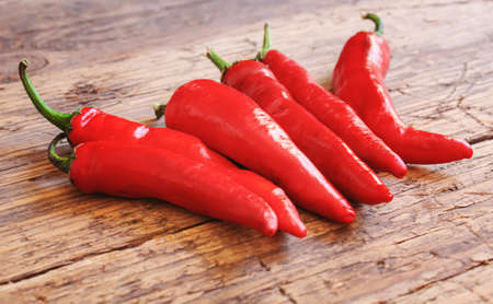 hot chili peppers on wooden background. selective focusの写真素材
