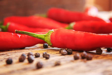 hot chili peppers on wooden background. selective focusの写真素材